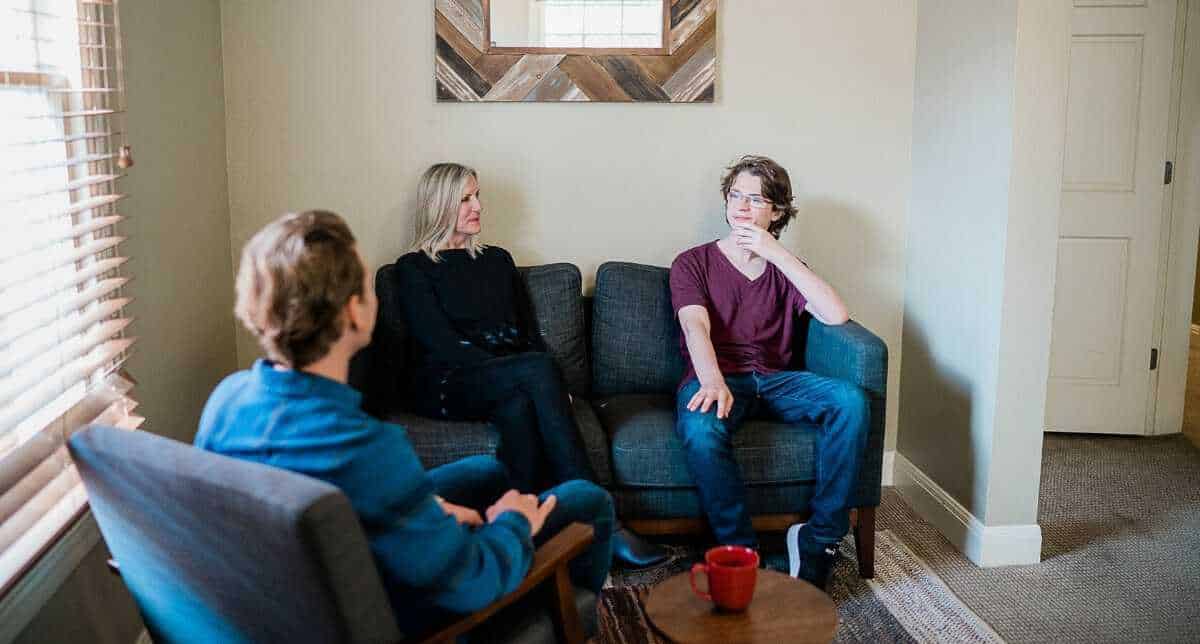 alpha180-about3 A family meets with a therapist to heal together during their student's recovery.