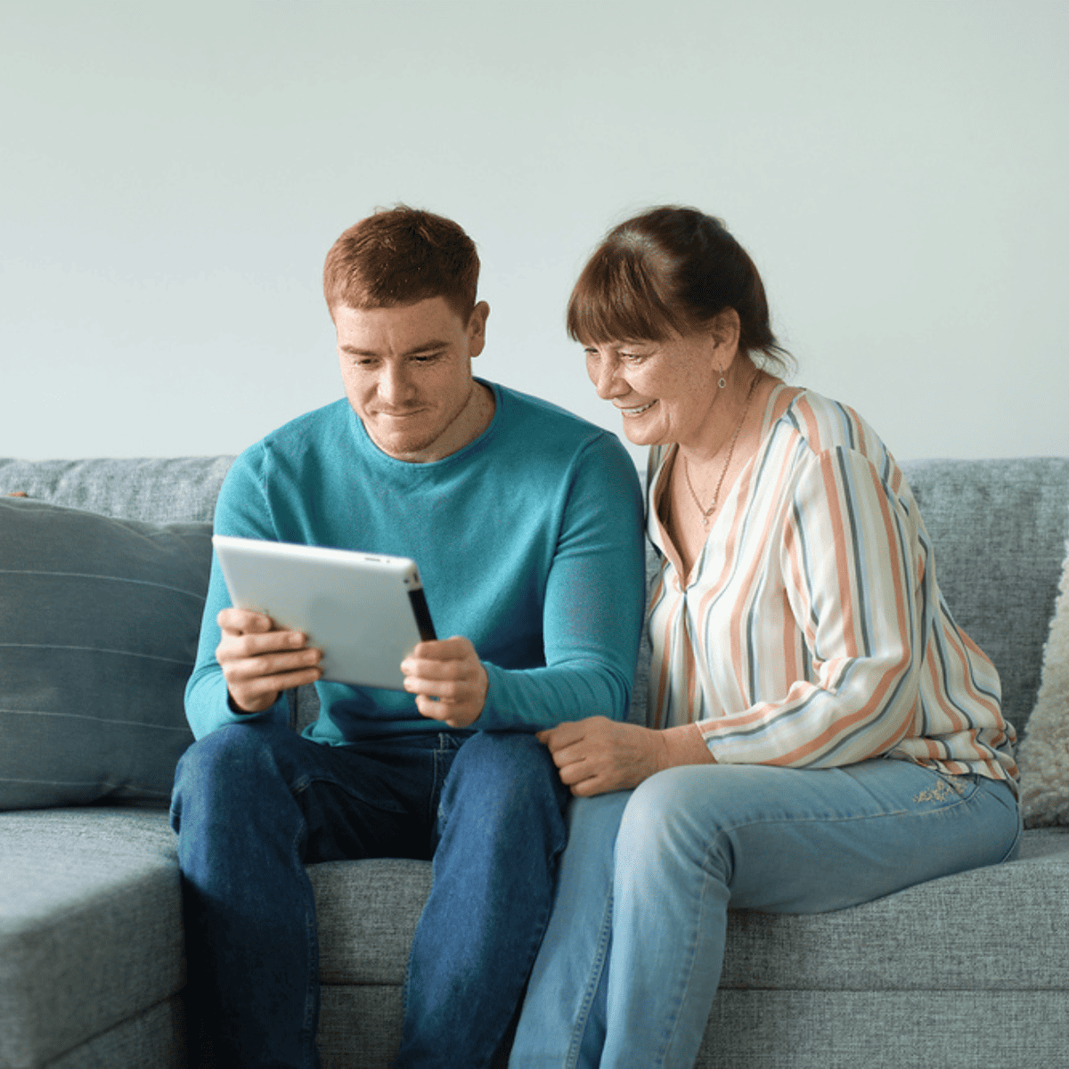 IOP lG (800 × 800 px) A mother and son review his recovery plan's family support section.